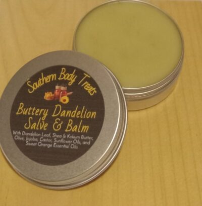 A tin of Sun-Kissed Dandelion Salve, a rich golden herbal balm made with dandelion, shea butter, and nourishing oils for deep skin hydration and repair.