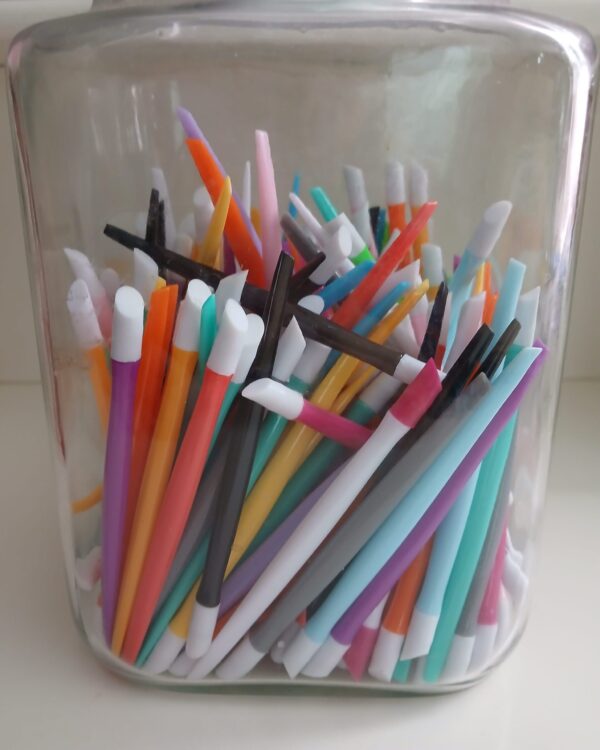 EZ Glide Cuticle Pushers in 10 vibrant colors with rubber tips for precise nail care