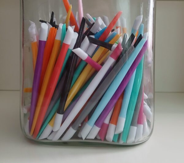 EZ Glide Cuticle Pushers in 10 vibrant colors with rubber tips for precise nail care