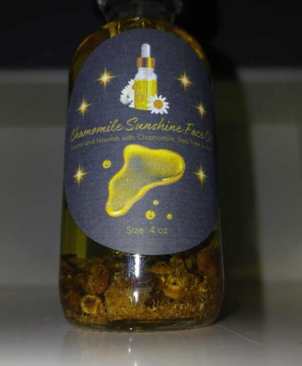 Chamomile Sunshine Face Oil in a glass bottle with chamomile flowers, aloe vera, and tea tree leaves on a wooden surface.