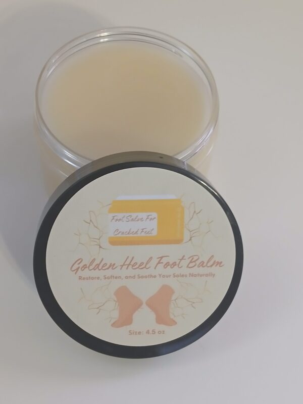 Golden Heel Foot Balm in a rustic jar surrounded by natural ingredients like kokum butter, cocoa butter, and essential oils.