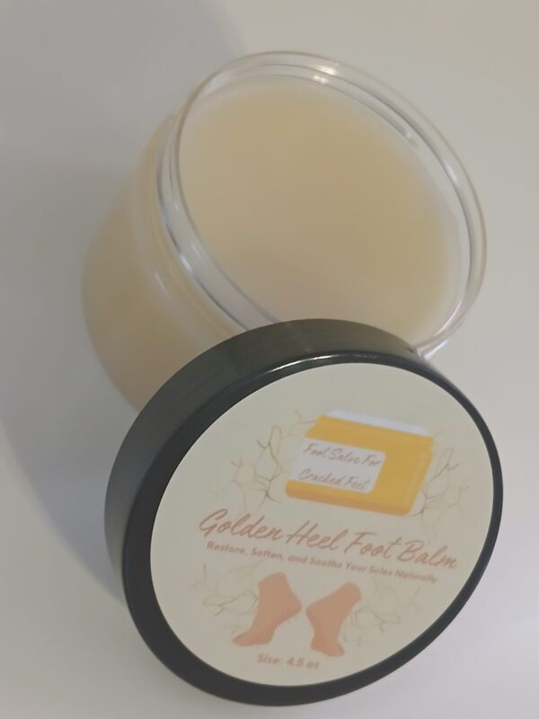 Golden Heel Foot Balm in a rustic jar surrounded by natural ingredients like kokum butter, cocoa butter, and essential oils.