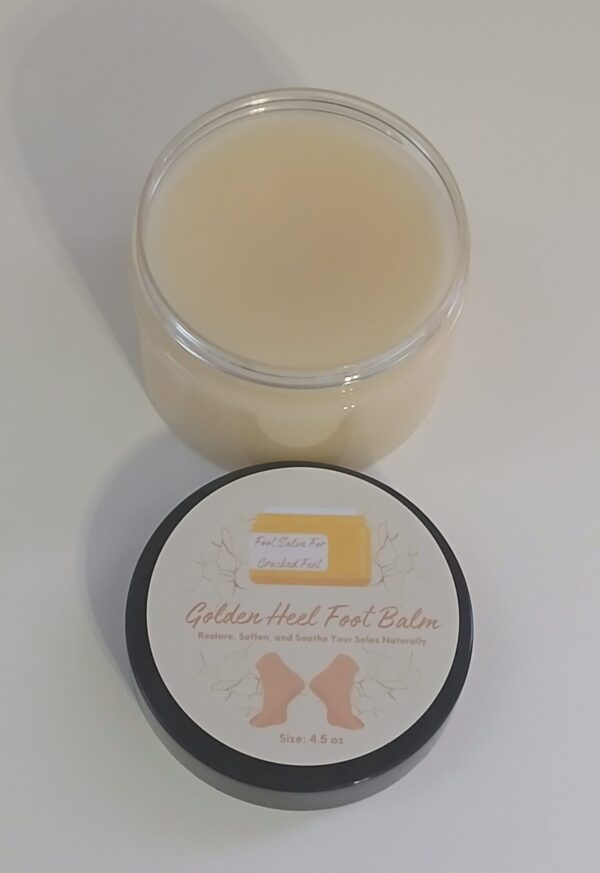 Golden Heel Foot Balm in a rustic jar surrounded by natural ingredients like kokum butter, cocoa butter, and essential oils.