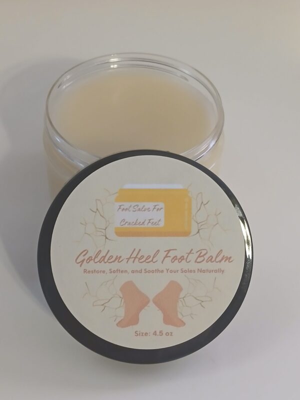 Golden Heel Foot Balm in a rustic jar surrounded by natural ingredients like kokum butter, cocoa butter, and essential oils.